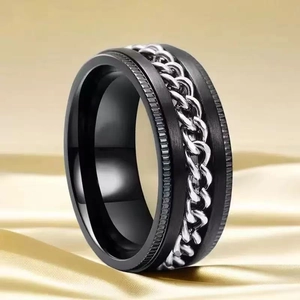 Black stainless steel spinner ring for men featuring a rotating silver Cuban chain inlay