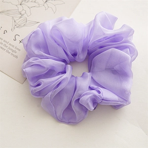 Detailed close-up of a large light purple chiffon scrunchie with rich pleated texture