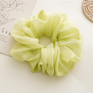 Oversized light green chiffon scrunchie with soft pleated texture for hair
