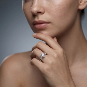 Halo round moissanite ring in 925 silver with infinity twisted diamond pavé band