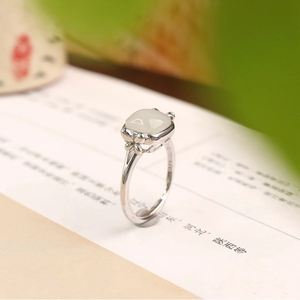Macro shot of S925 sterling silver ring hallmark and square Hetian jade gemstone
