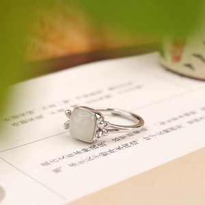 Macro side view of a vintage S925 silver ring featuring a square Hetian jade gemstone