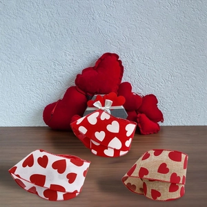 Red heart printed ribbons in burlap and fabric for Valentine gift wrapping and DIY decor