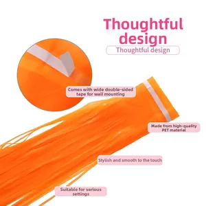 Close-up of orange PET fringe curtain with self-adhesive tape for party background