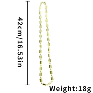 Close-up of gold-plated cylindrical beads necklace with size and weight detail markings