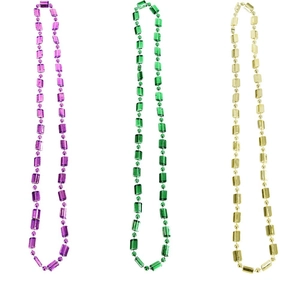 Close-up of purple, green and gold plastic bead necklaces for Carnival party decor