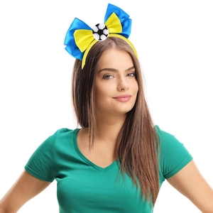 Detail of blue and yellow soccer bow headband worn by a model for sport events