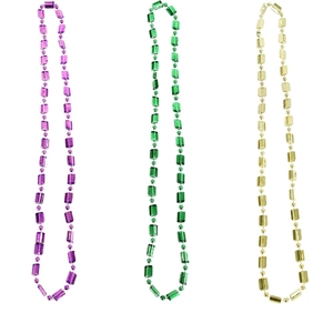 Three Mardi Gras bead necklaces in purple, green and gold with spherical and cylindrical beads