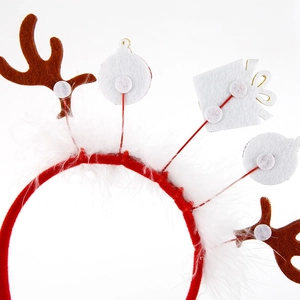 Christmas headband with brown reindeer antlers and gift box decor on white background