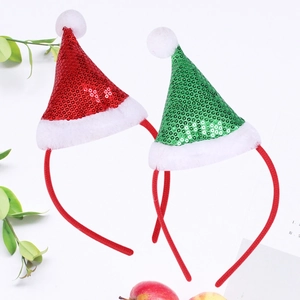 Detail of red and green sequined Christmas hat headbands with white fuzzy trim