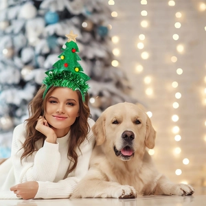 Detailed view of festive Christmas tree headband with golden star and colorful pompoms