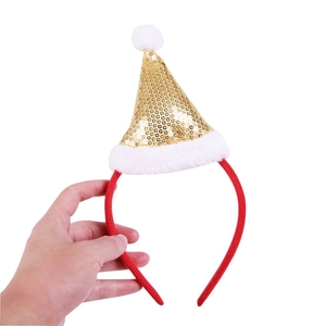 Close-up of festive Christmas hat headband with sparkling gold sequins and white faux fur trim