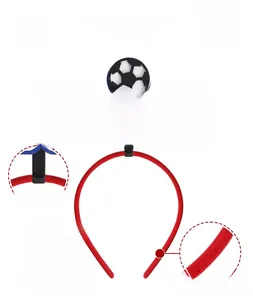 Detail of plush soccer headband with detachable blue and white SOCCER letter ornaments