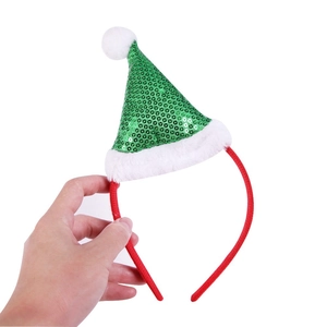 Detail of sequined Christmas elf hat headband with soft white plush trim and red frame