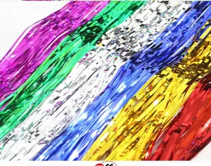 Detail of vibrant metallic foil fringe curtains in six colors for party backdrop decoration