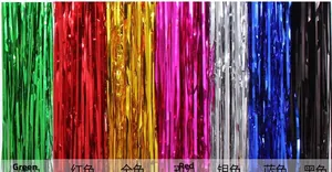 Detailed close-up of colorful fringe foil curtains in various metallic party decor shades