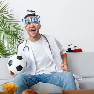 Detail of soccer party glasses with blue white stripes and SOCCER text for sports events