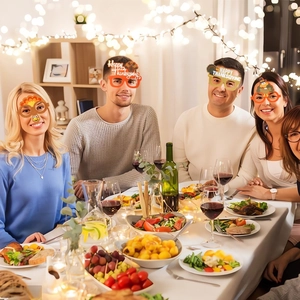 Group of friends wearing turkey glasses during a happy Thanksgiving dinner party
