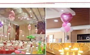 Dettaglio di palloncini a stella e cuore rosa e bianchi per decorazioni per feste interne