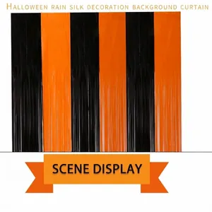 Detail of Halloween tinsel curtain with alternating orange and black metallic fringes