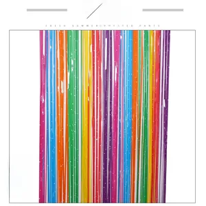 Detailed macro view of rainbow foil fringe curtain with white star pattern decorations