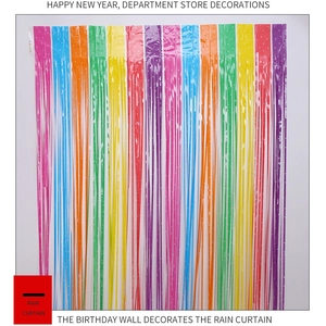Close-up of vibrant rainbow fringe foil curtain for festive party backdrop decorations