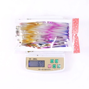 Detailed view of iridescent gradient tinsel curtain on a scale for weight measurement