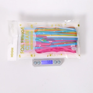 Detailed weight measurement showing multi-color foil fringe curtain at 72.2 grams