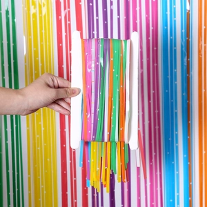 Colorful festive fringe curtain backdrop with star patterns for party decorations