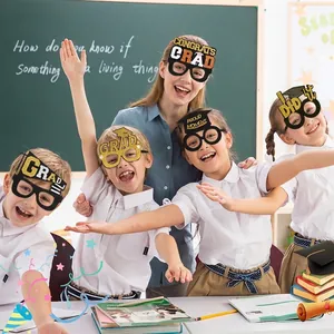Black and gold graduation party photo booth glasses featuring Grad and Congrats slogans