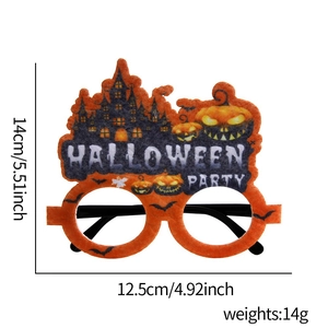 Detailed view of Halloween felt party glasses with pumpkin and haunted castle motifs