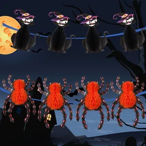 Hanging Halloween decorations featuring paper honeycomb black cat and orange spider ornaments