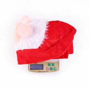Weight measurement of Santa drawstring gift bag showing 114g on a digital scale