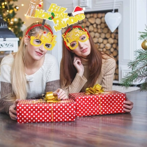 Spanish Christmas party set with golden Feliz Navidad headbands and glitter elk glasses