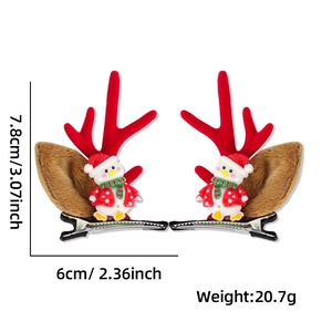 Détail de pinces à cheveux bois de renne de Noël avec pingouin et nœud rouge mignon
