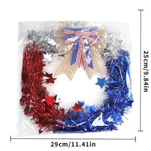 Independence Day wreath detail with tinsel stars and burlap American flag bow