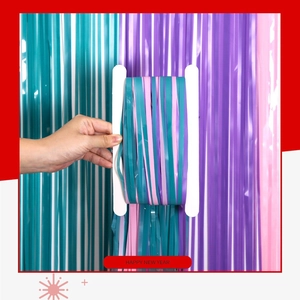 Close-up of macaron blue, purple, and pink foil fringe curtains for party backgrounds