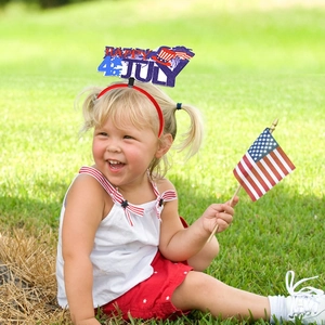Close-up of child wearing Happy 4th of July headband with stars and stripes elements