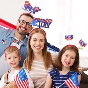 Family wearing 4th of July headbands with USA flags and stars for Independence Day