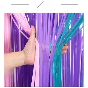 Close-up of pink, purple and cyan metallic foil fringe curtains for party backgrounds