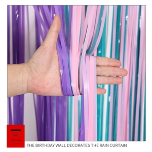 Detail of macaron blue purple pink tinsel curtain with shiny metallic foil fringes