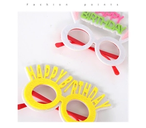 Detail showing two pairs of felt Happy Birthday glasses with colorful letters for party fun
