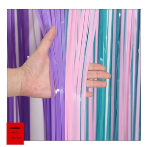 Close-up of macaron purple, pink, and cyan fringe foil rain curtain for party background