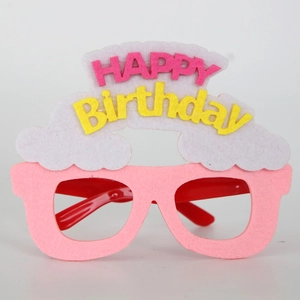 Detail of pink felt birthday glasses featuring white clouds and Happy Birthday letters