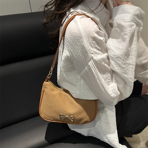 French retro woven shoulder bag with silver bow decoration and brown leather trim