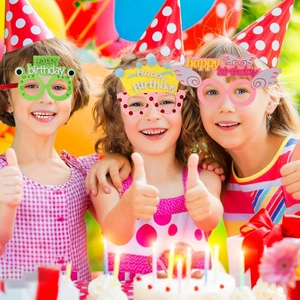 Three children wearing colorful animal and crown party glasses with Happy Birthday text