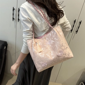 Pink tote bag with butterfly embroidery, woven straps and tassel charm for women
