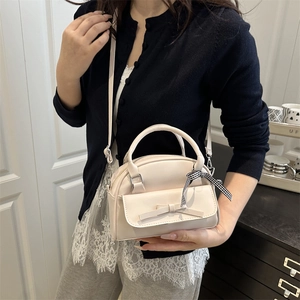Chic beige square crossbody bag with 3D bow and checkered ribbon strap detail