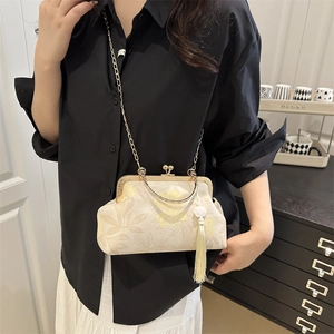 Vintage floral crossbody bag with gold chain strap and tassel detail for women