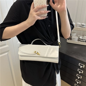 White baguette shoulder bag with crocodile texture and gold metal buckle detail